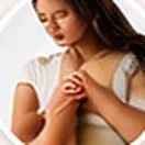 Woman scratching her arm