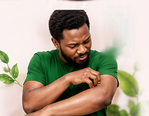 Man scratching his itchy arm