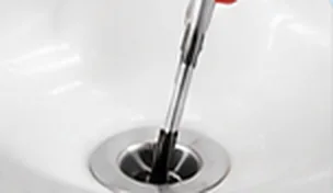 Pushing the grabber into the drain