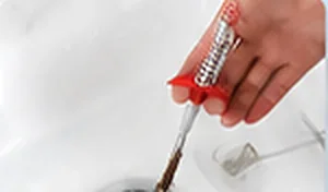 Pulling the hair out of the drain